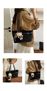 Borsa in velluto nero, mostrata in quattro viste e portata a mano o a spalla, con fibbia e orsetto.