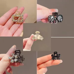 Collage of small clips with rhinestone, flower and bow details in gold, black and ivory finishes