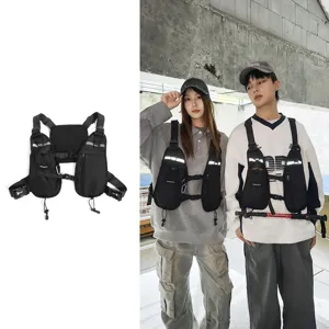 Black multi-pocket chest pack shown alone and worn by two models with adjustable straps