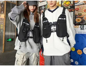 Two models display black chest bags with reflective strips, zip pockets and adjustable straps.