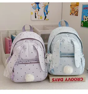 Deux sacs à dos pastel à pois, avec oreilles de lapin, pompons doux et pampilles perlées