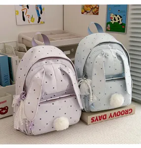 Deux sacs à dos pastel à pois, avec oreilles de lapin, pompons et breloques en dentelle perlée