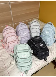 Six sacs à dos scolaires pastel, présentés ensemble avec motifs étoilés et breloques en peluche