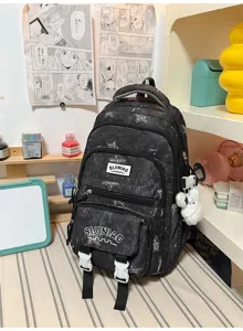Vue de face avec poches zippées, motifs étoilés, boucles blanches et petit pendentif en peluche