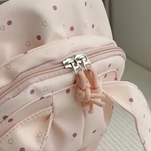 Sac à dos rose à oreilles de lapin, imprimé à pois et cœurs, deux compartiments et tirettes nouées