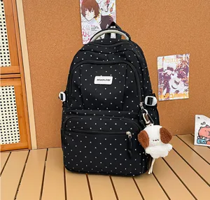 Tissu noir à pois blancs, poches zippées superposées et petit pendentif chien en peluche