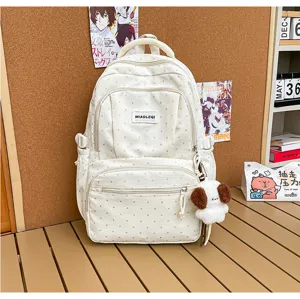 Sac blanc à pois gris, poche avant zippée, filet latéral et petit chien en peluche accroché