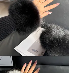 Close-up of a black fluffy wrist cuff worn over a knit sleeve, shown on hand from two angles