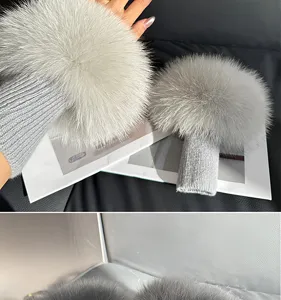 Close-up of a gray fluffy wrist cuff with a ribbed knit sleeve, shown worn and laid flat