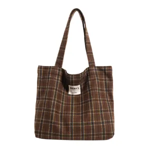 Large brown plaid fabric tote bag with shoulder straps, shown against a white background