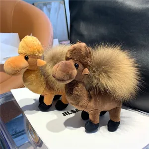 Two plush camel bag charms in light and dark brown, with fluffy humps, shown together