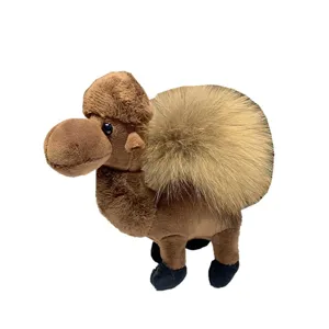 Brown plush camel keychain toy with a fluffy tan hump and black hooves, shown standing on white