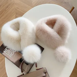 Women's fluffy fur loop scarves in white and blush pink, shown with matching pom-pom accents