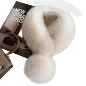 Women's winter fur neck warmer in ivory and beige, shown flat with a large fluffy pompom