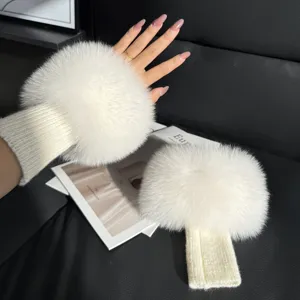 White fluffy winter wrist warmers with ribbed knitted cuffs, shown worn and laid flat for winter