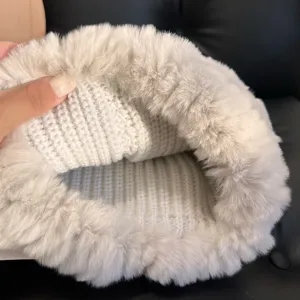 Close-up of the soft plush lining and white knitted interior of a warm winter headwear accessory