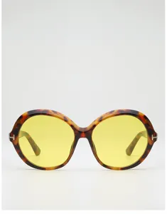 Front view highlighting tortoiseshell round frames, yellow lenses, and subtle metal hinge accents