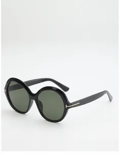 Black round sunglasses with dark green lenses and gold T-shaped temple accents, side view