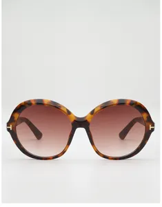 Front view of round tortoiseshell frames with brown gradient lenses and gold T-shaped temple accents