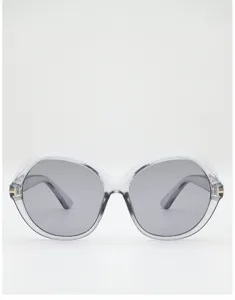 Front view of transparent gray round frames with gradient gray lenses and gold temple accents