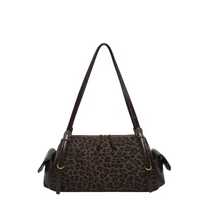Front view of a brown leopard-print bag with dark straps, gold-tone hardware and side pockets