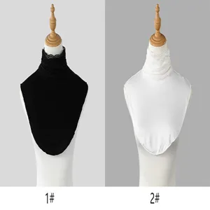 Side-by-side display of black and white lace-trimmed collar inserts on dress forms for comparison