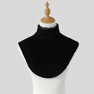 Black lace stand collar with a soft knit bib, displayed on a mannequin against a light gray backdrop