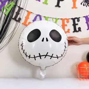 Close-up of a white foil balloon with a stitched black skull face at a Halloween party