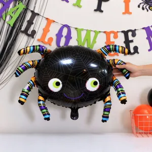 Close-up of a black foil spider balloon with colorful striped legs and a playful face at Halloween