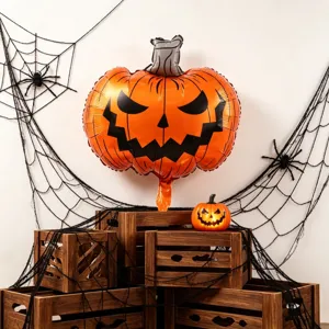 Halloween display with an orange foil pumpkin face balloon, gray stem, webs and wooden crates