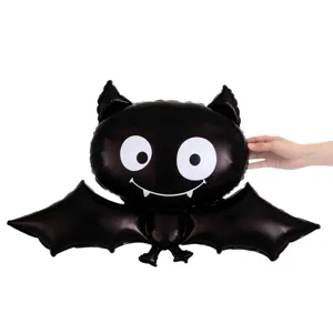 Black foil Halloween bat balloon with wide wings and a cute smiling face, shown on white