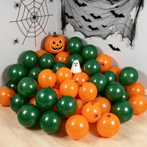 Halloween scene with glossy orange and green balloons, pumpkin, ghost and spiderweb decor