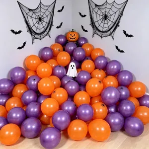 Halloween party balloon set in orange and purple, arranged beneath spiderwebs with bats and ghost