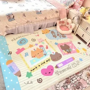 Pastel cartoon rug beside a bed, printed with cats, a bear, hearts, stars and pencil doodles
