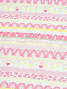 Close-up of pink strawberries, stars, hearts and bows in decorative horizontal fabric stripes
