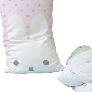 Long bunny-shaped cushion in pink and white with gray stars, beside a blue snowflake cushion