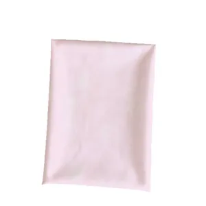 Strawberry-slice tablecloth fabric in a soft pink flat envelope-style package on white background