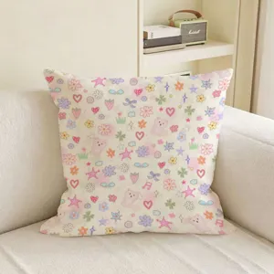 Pastel square cushion with tiny bears, flowers, hearts and stars, displayed on a white sofa
