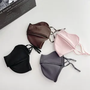 Four 5D winter masks in brown, black, pink and gray, with contoured panels and adjustable straps
