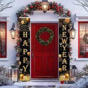 Pair of black and gold New Year door banners with HAPPY NEW YEAR lettering on a snowy porch