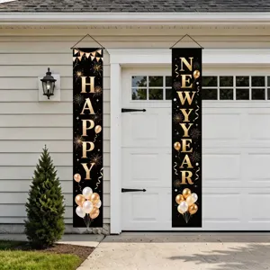 Pair of black New Year banners with gold lettering, balloons and fireworks on a garage door