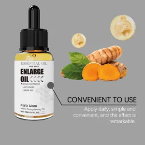 15 ml druppelflesje mannenolie naast kurkumawortels, groene bladeren en zwevende oliedruppels