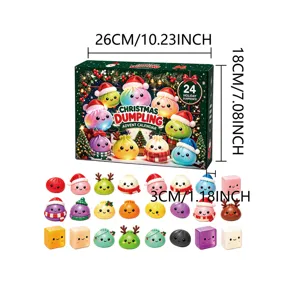 Twenty-four colorful Christmas dumpling figures arranged beside their advent calendar box