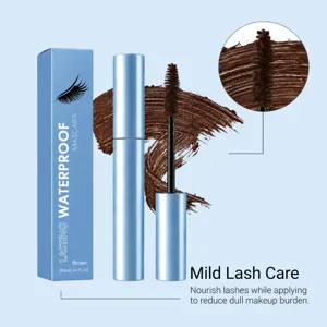 Close-up of the brown mascara brush and coating, beside blue packaging and a lash swatch