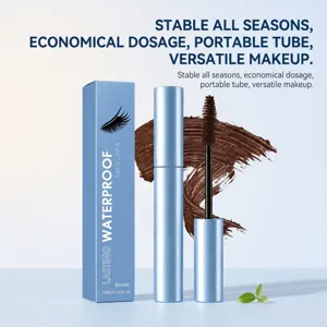 Brown mascara wand and textured swatch beside a metallic blue tube and matching box display