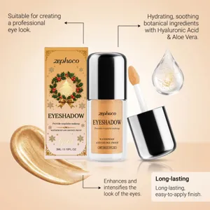 Goldener Flüssig-Lidschatten mit Schachtel, Applikator und Glitzerstrich auf warmem Farbgrund