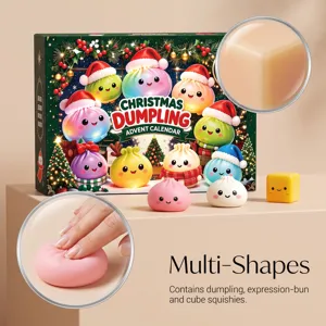 Close-up of a hand squeezing a soft pink bun-shaped toy, with a cube squishy and festive box