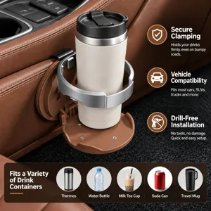 Close-up of a silver drink holder clamped to a brown car console, securing a travel tumbler