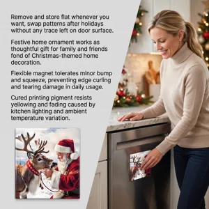 Woman placing a Christmas magnet with Santa and reindeer on a stainless steel appliance