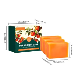 Green gift box beside three orange soap bars, with size measurements shown on a white background